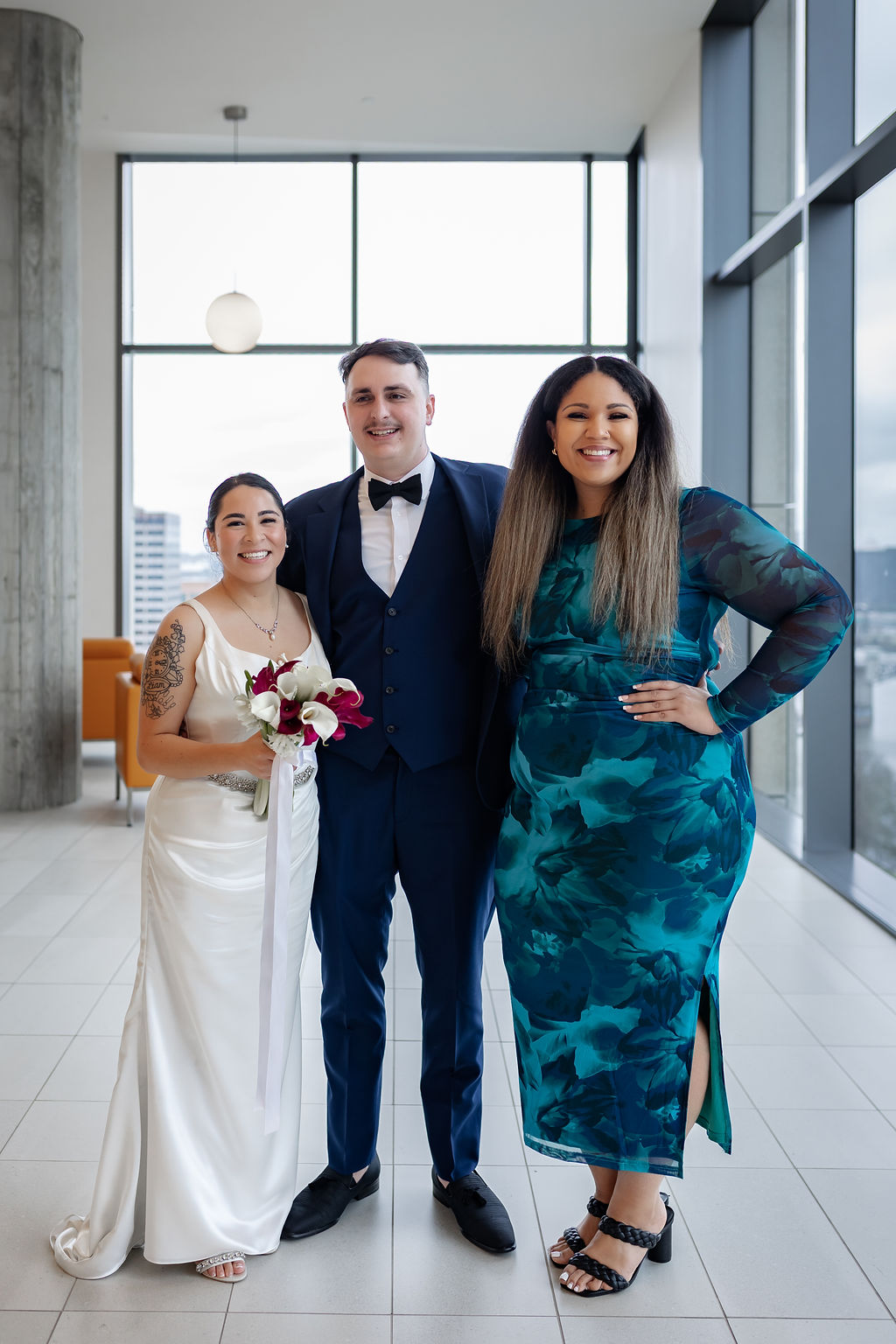 Isabel with the bride and groom at their downtown wedding